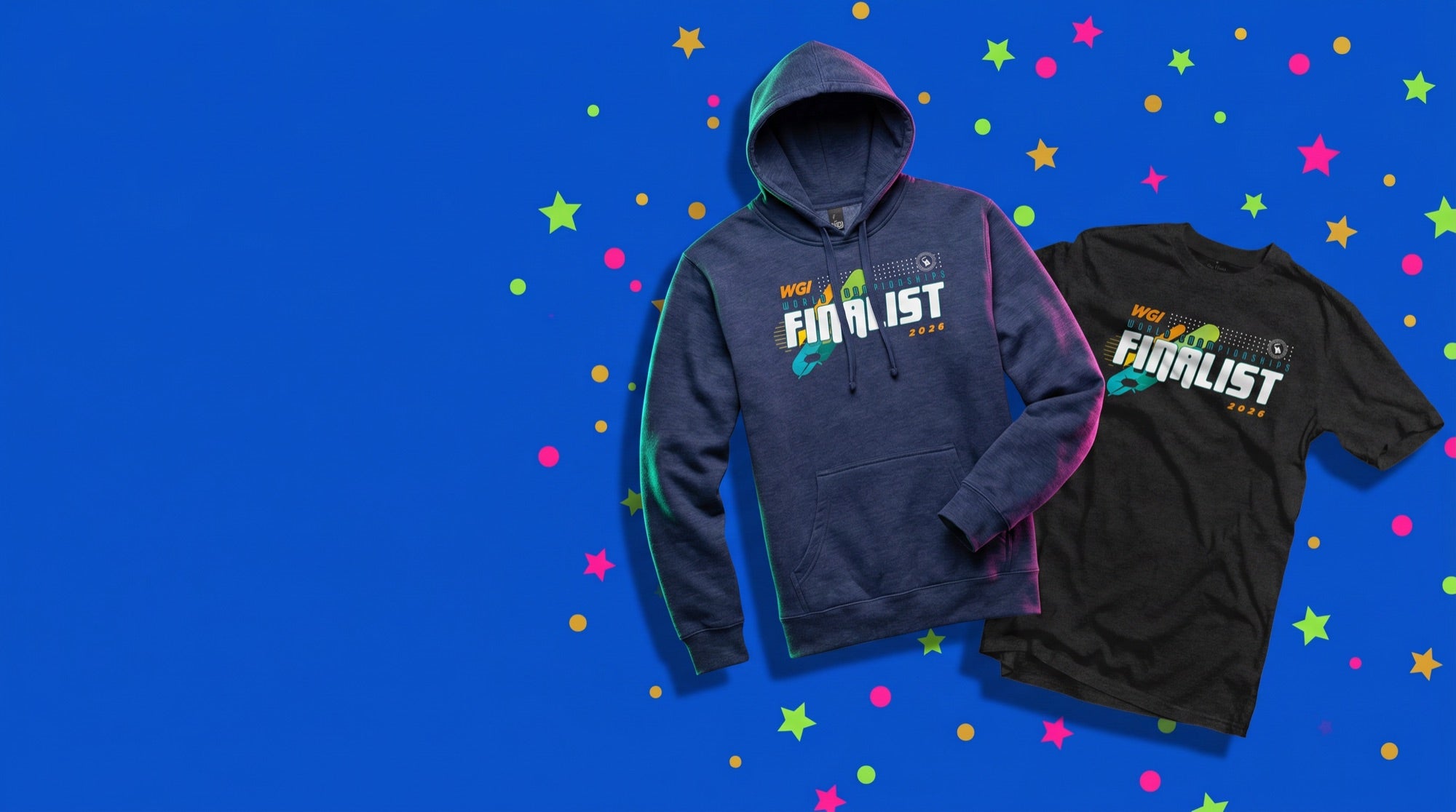 WGI 2026 Worlds Championships Finalist hoodie and t-shirt on a confetti-filled royal blue backdrop